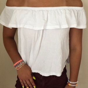 Loose, off the shoulder, white top.